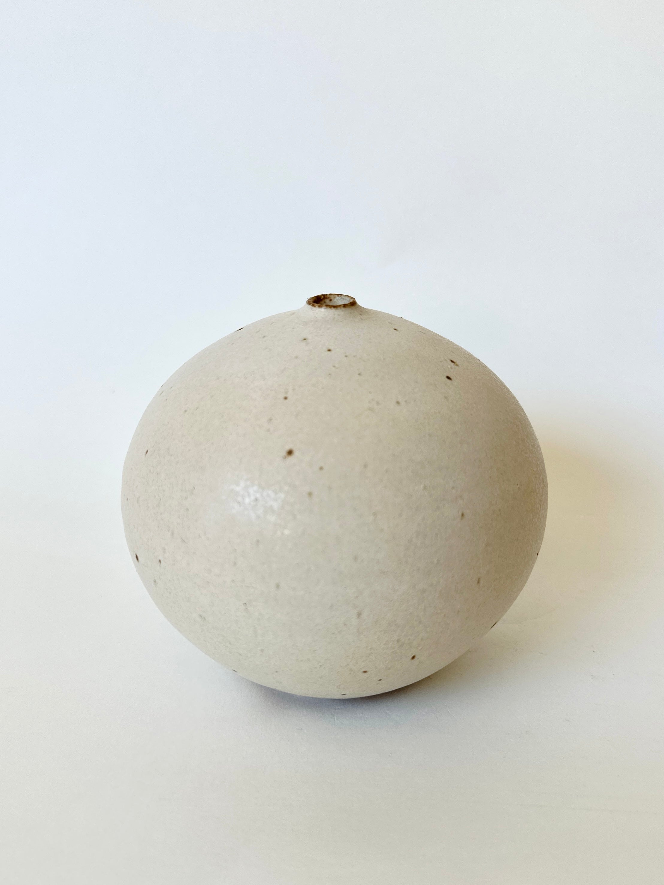 Warm satin white speckled orb no. 17