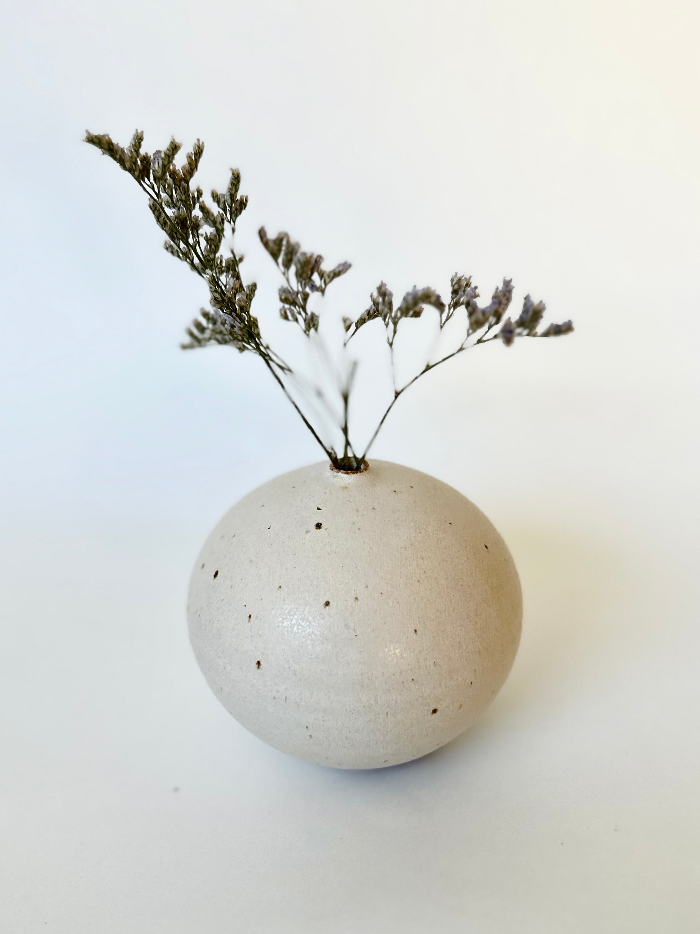 Warm satin white speckled orb no. 17