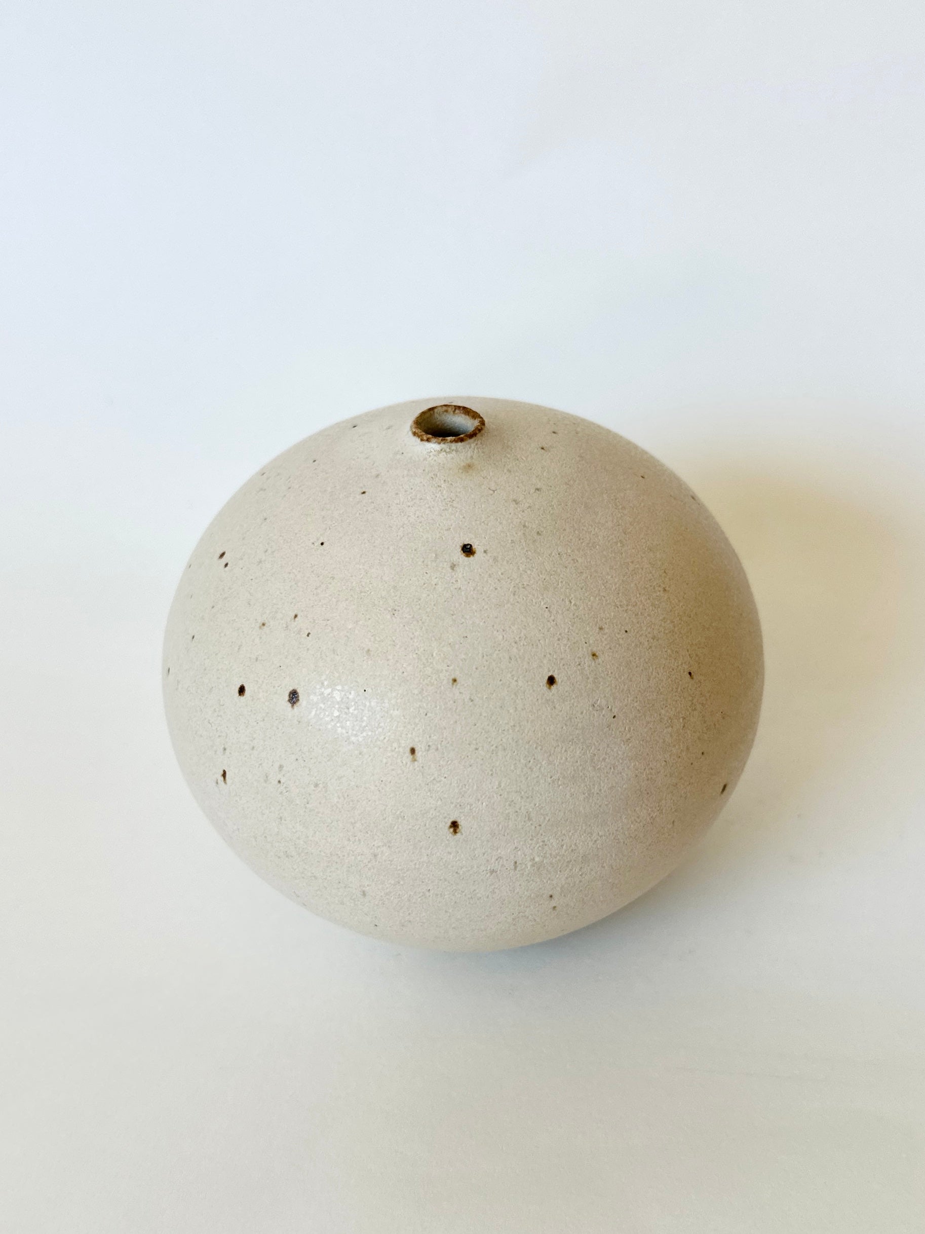 Warm satin white speckled orb no. 17