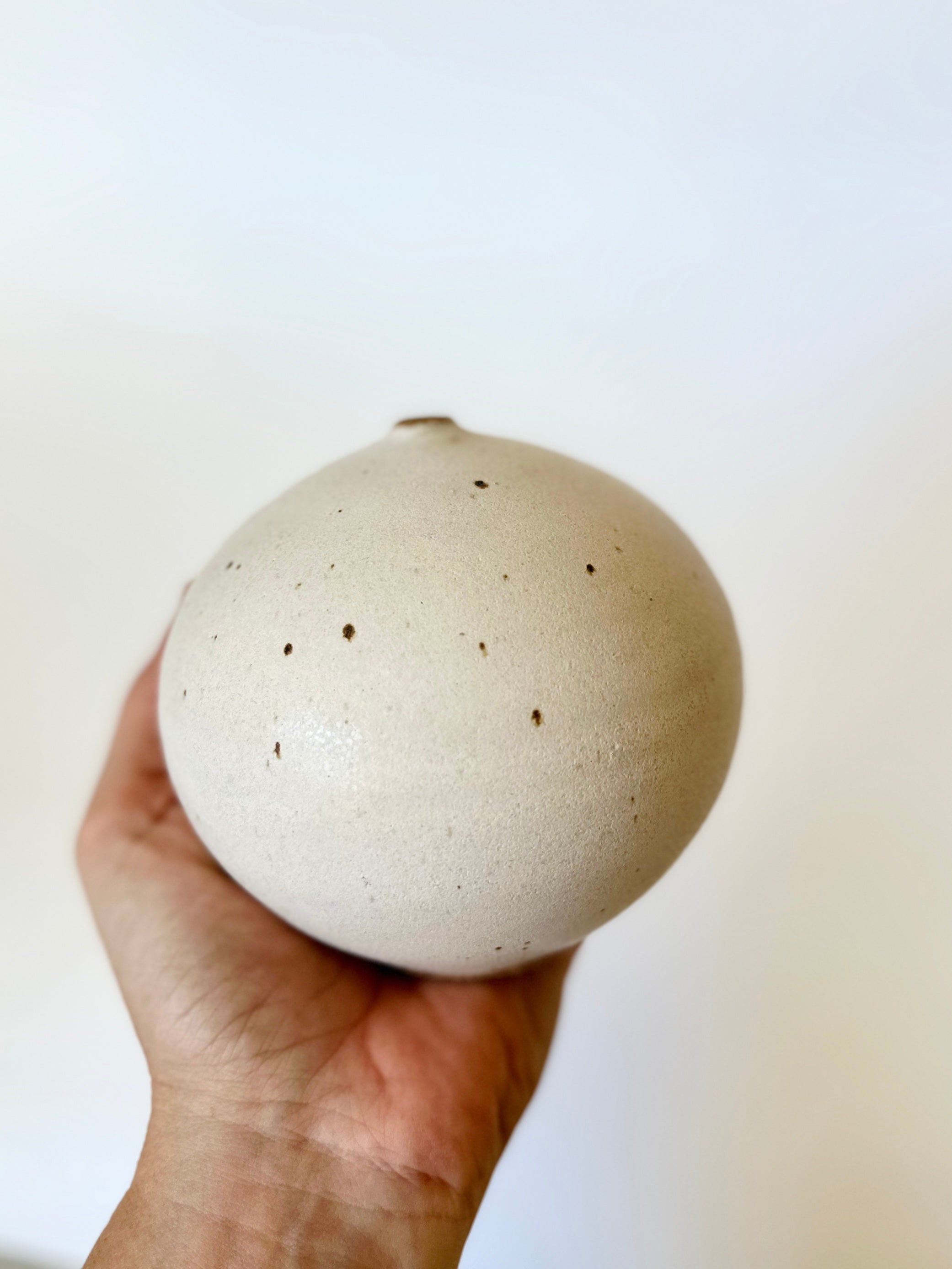 Warm satin white speckled orb no. 17