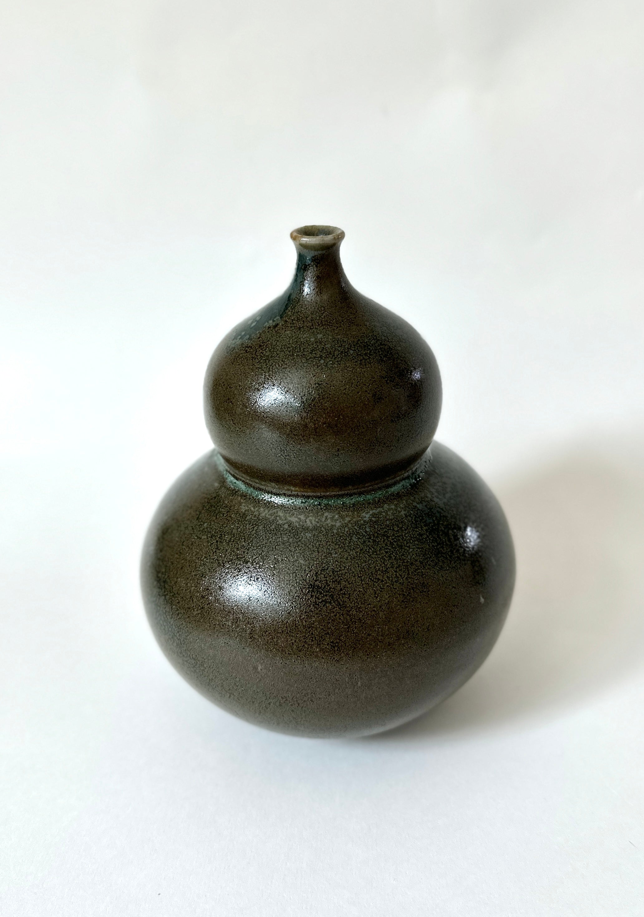 Bronze and celadon bubble vessel