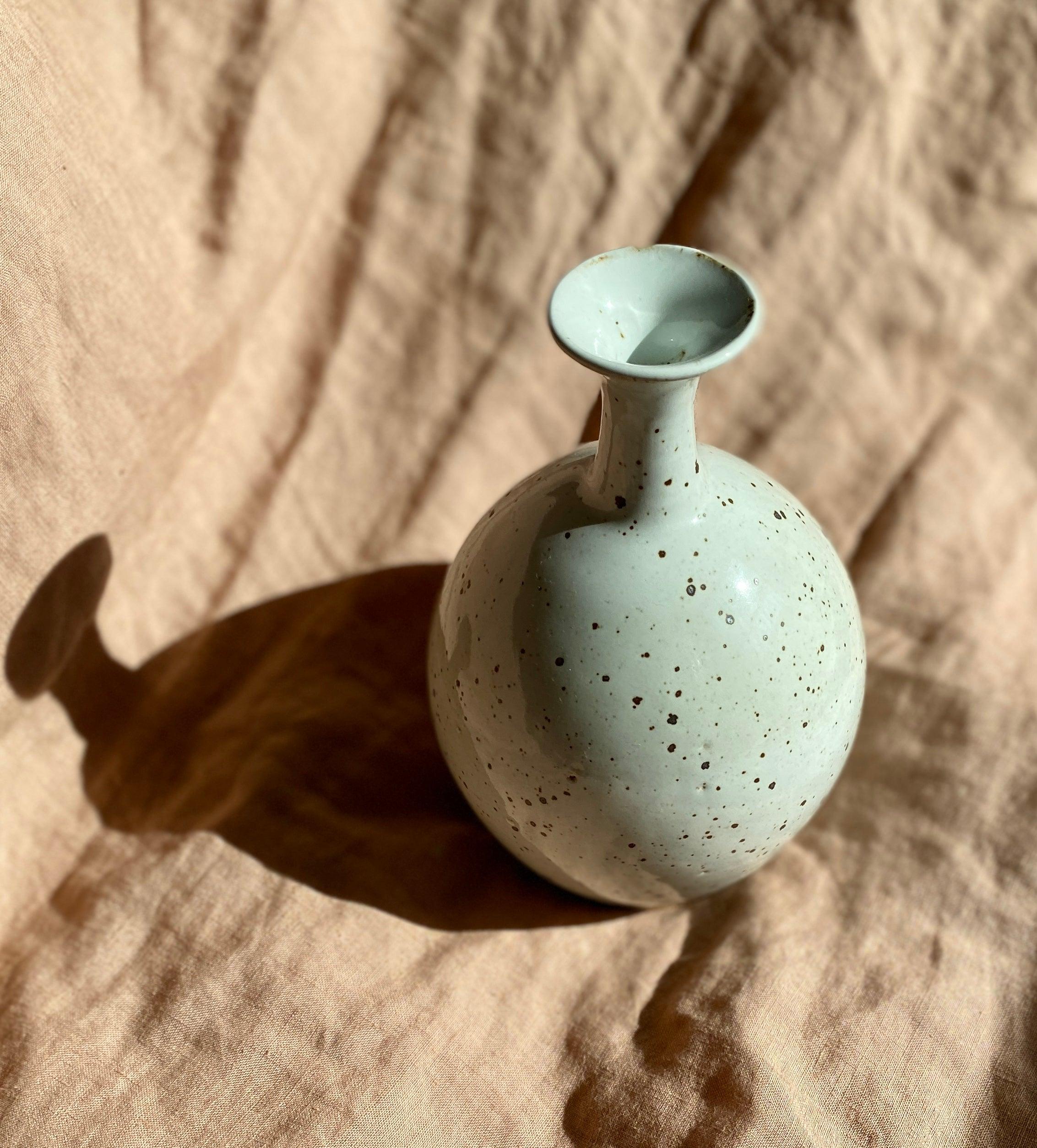 Glossy white speckled bottle-neck vase - Dana Chieco Studio