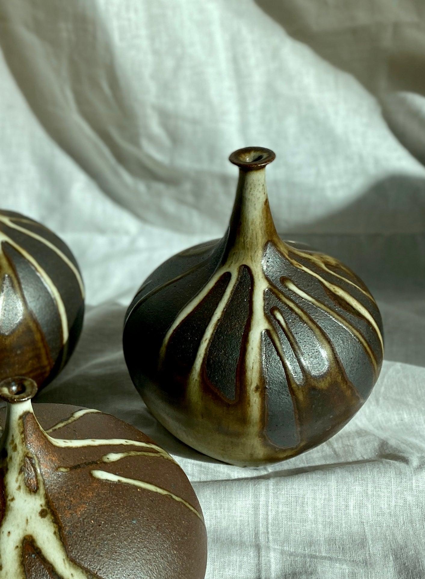 Poured glaze on black clay no. 1 - Dana Chieco Studio