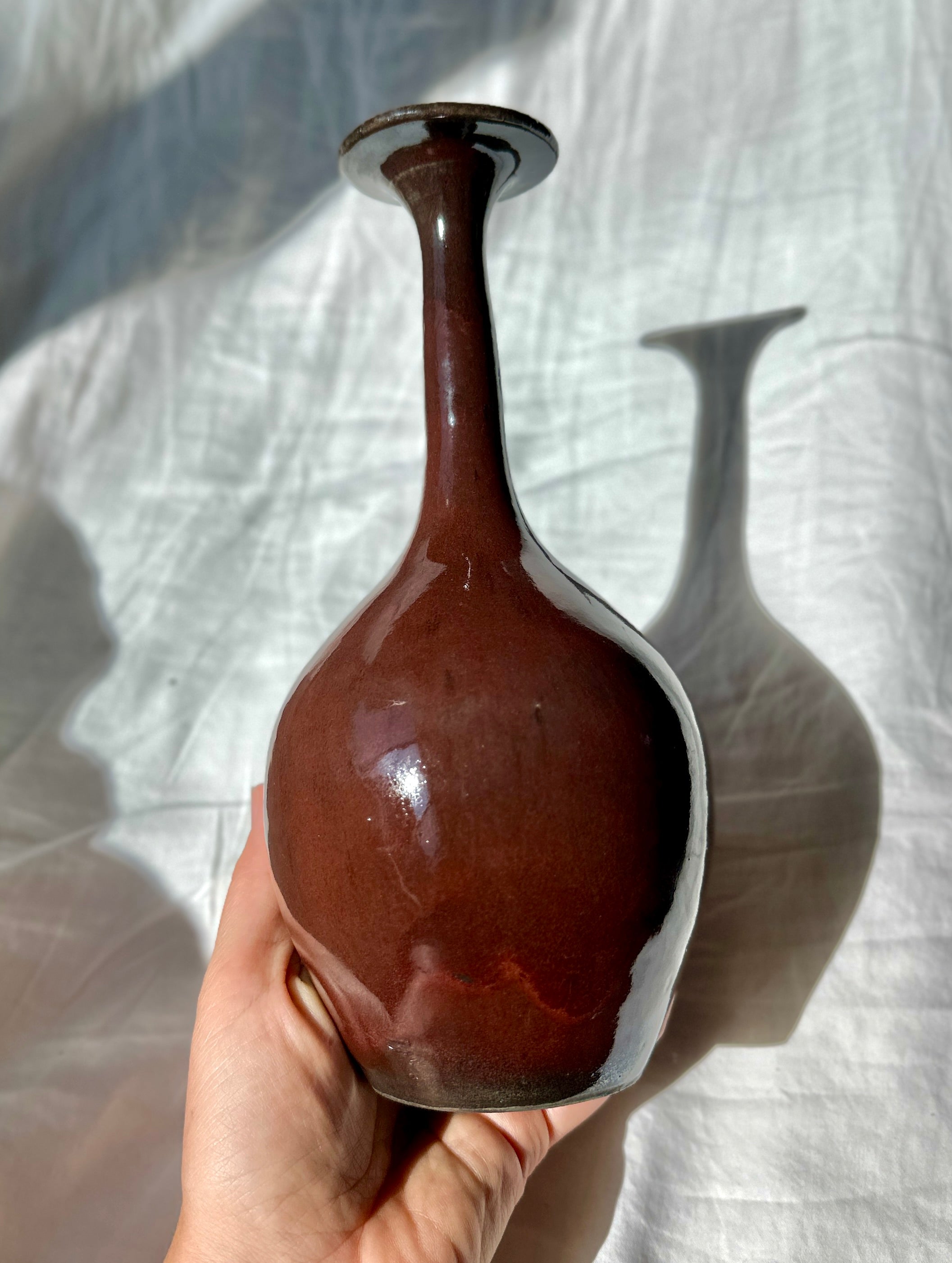 Raku glossy burgundy bottleneck