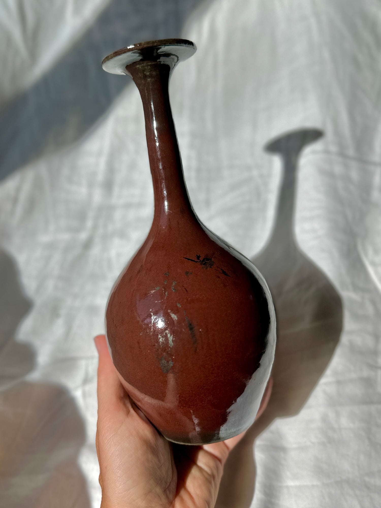 Raku glossy burgundy bottleneck