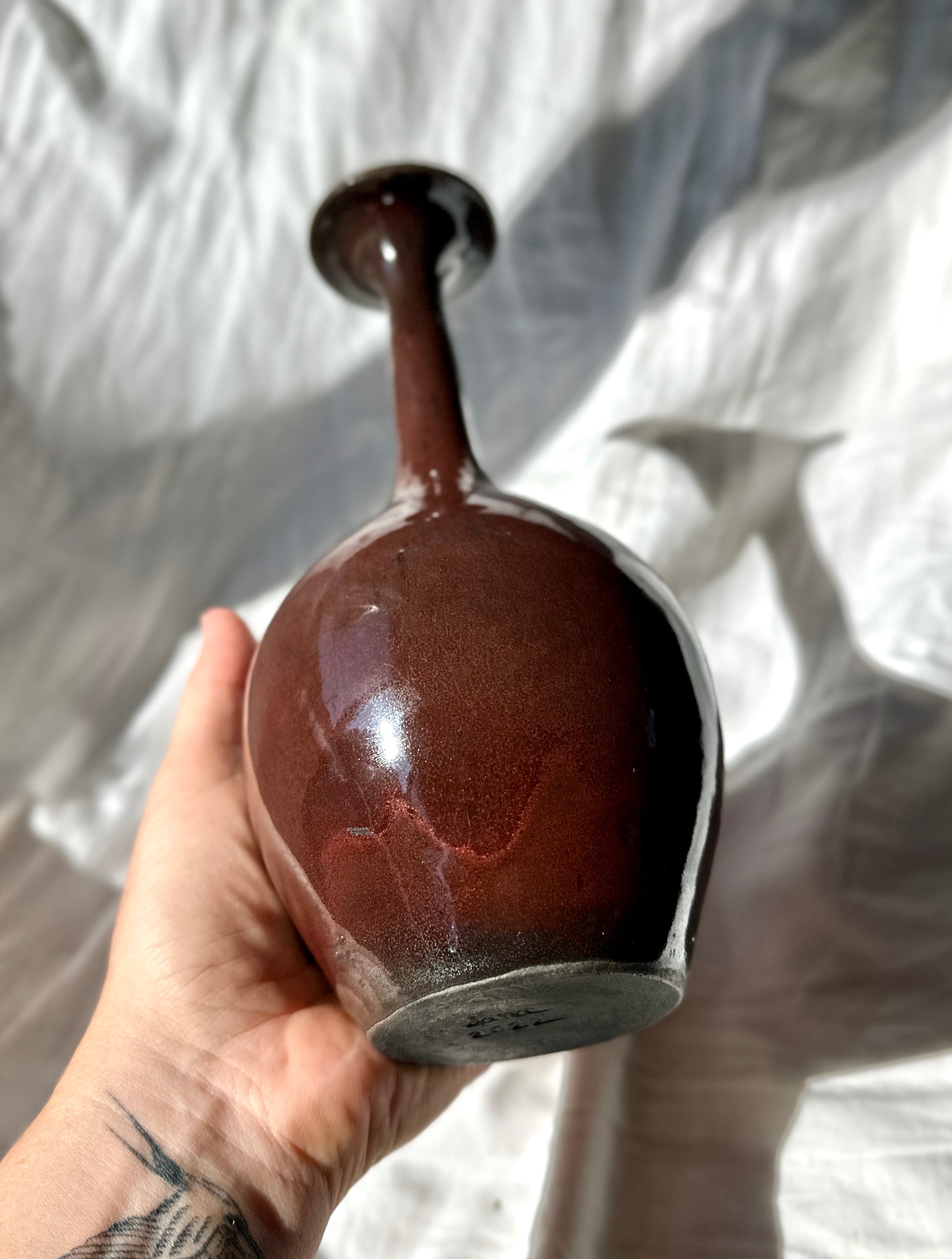 Raku glossy burgundy bottleneck