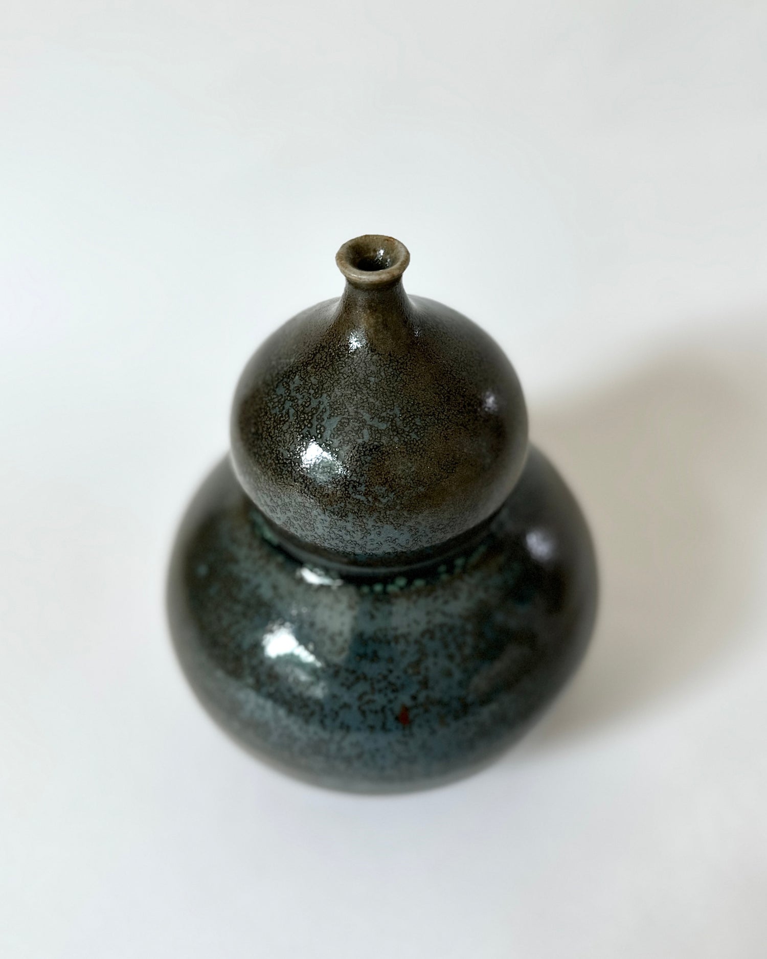 Bronze and celadon bubble vessel