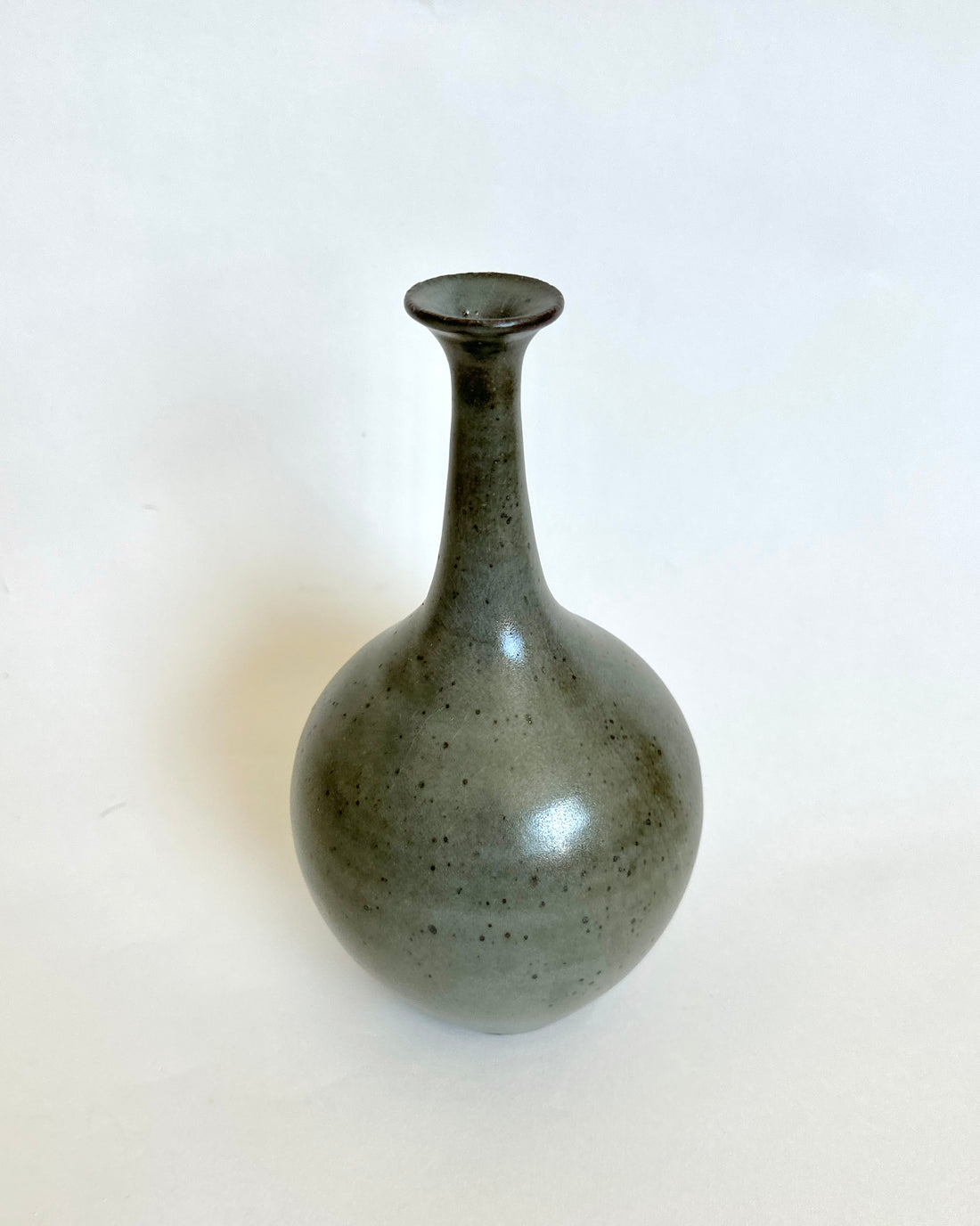 Black clay bottleneck with celadon no. 3